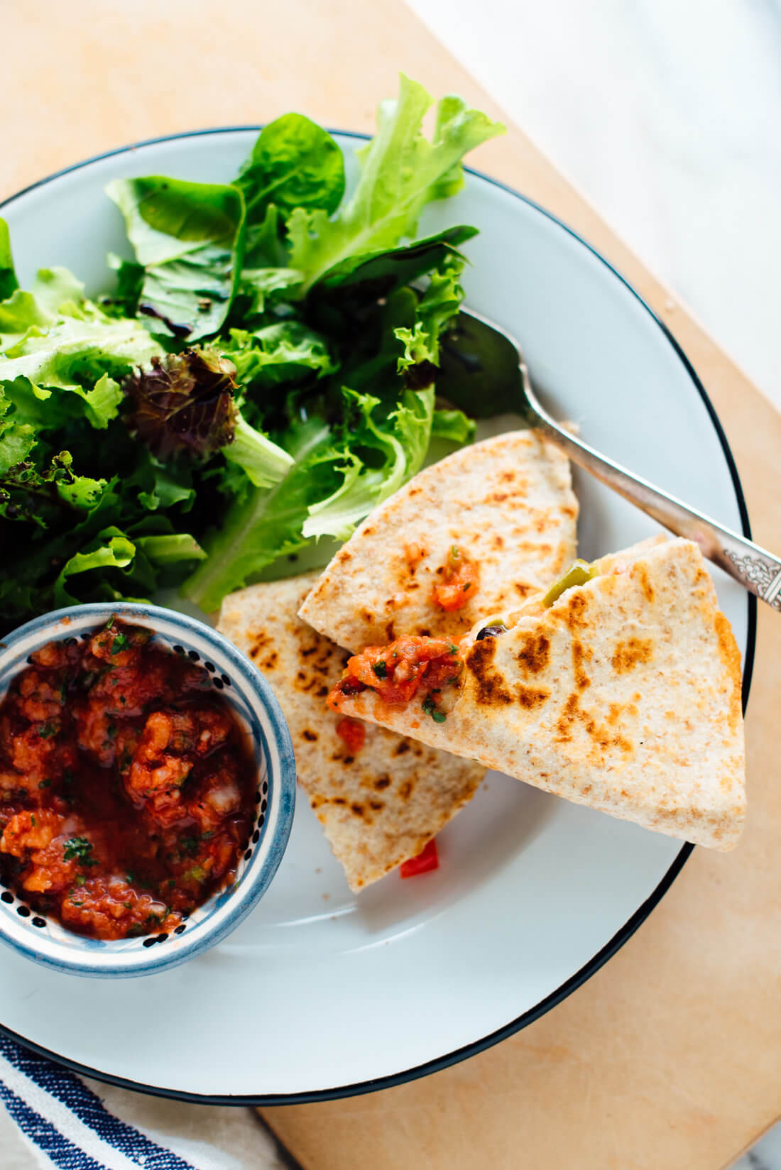 These 10-minute quesadillas are my favorite quick meal! This simple recipe is made with whole grain tortillas and lots of veggies, so these quesadillas are more healthy than most. cookieandkate.com